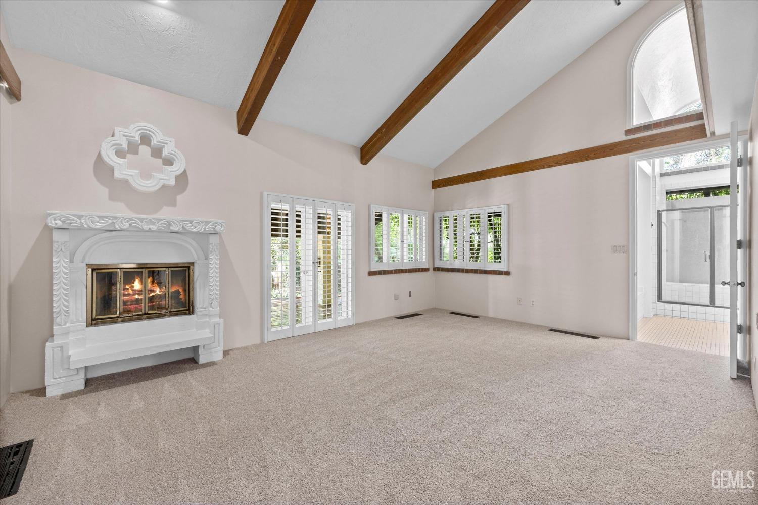 Undisclosed Address Bakersfield, CA 93306 - Photo 28 of 75 a view of an empty room with a fireplace and a window