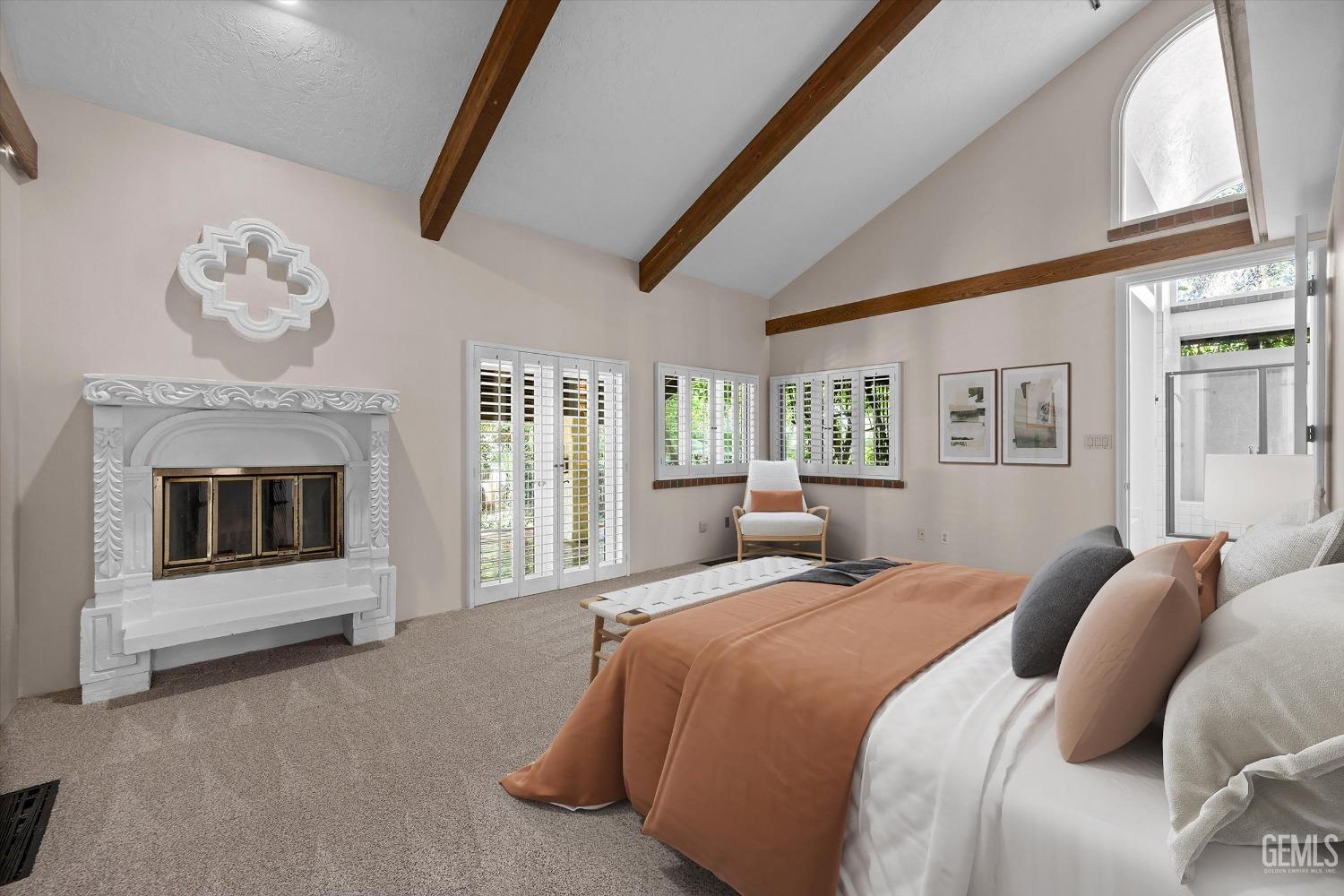 Undisclosed Address Bakersfield, CA 93306 - Photo 29 of 75 a spacious bedroom with a balcony a bed and a fireplace