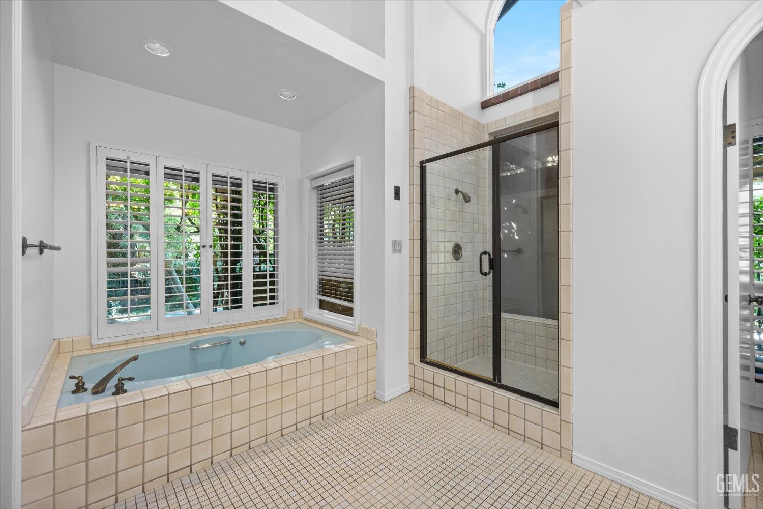 Undisclosed Address Bakersfield, CA 93306 - Photo 31 of 75 a bathroom with a bathtub and shower