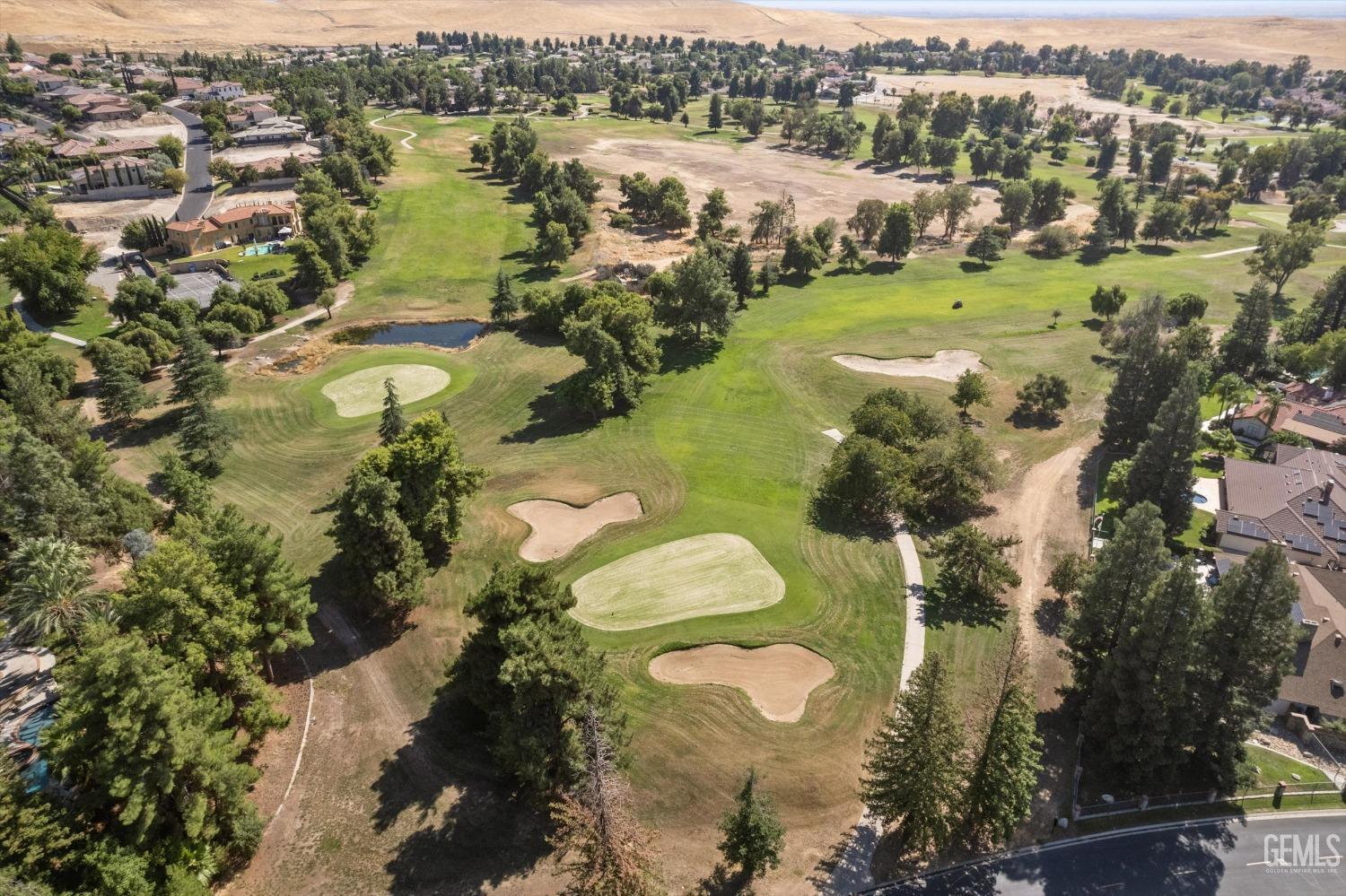 Undisclosed Address Bakersfield, CA 93306 - Photo 5 of 75 a view of a lake with a houses