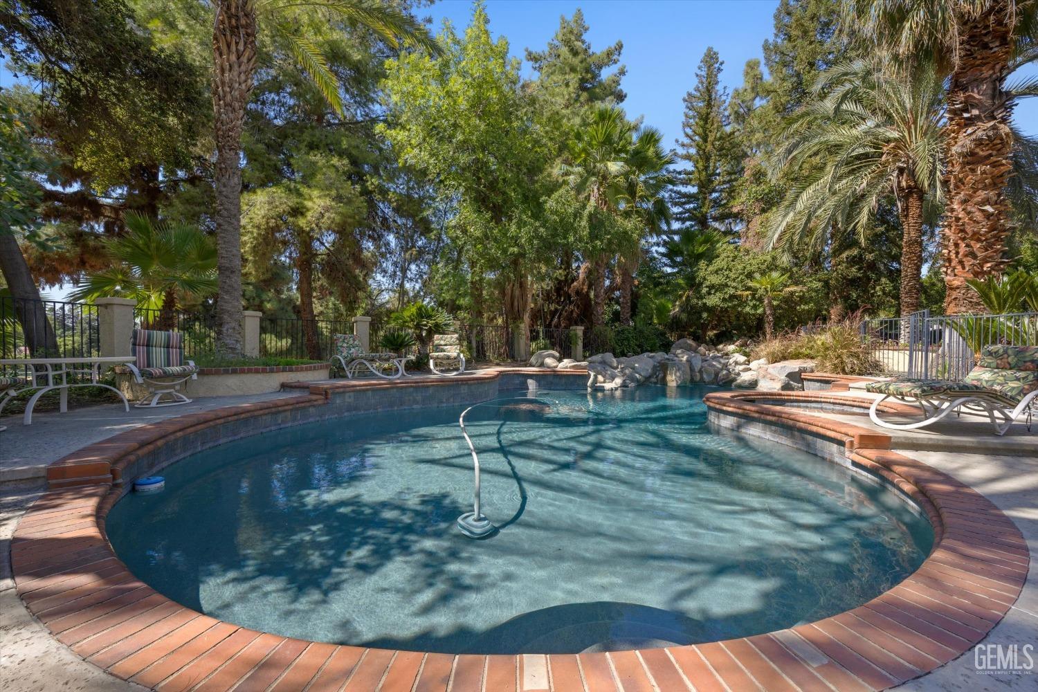 Undisclosed Address Bakersfield, CA 93306 - Photo 56 of 75 a view of a swimming pool with an outdoor seating