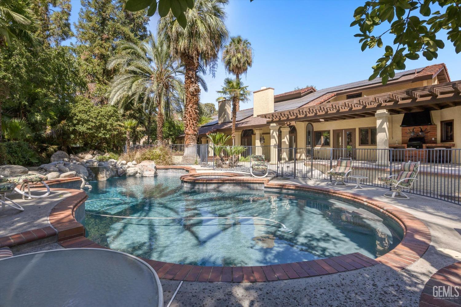 Undisclosed Address Bakersfield, CA 93306 - Photo 57 of 75 a view of a swimming pool with outdoor seating