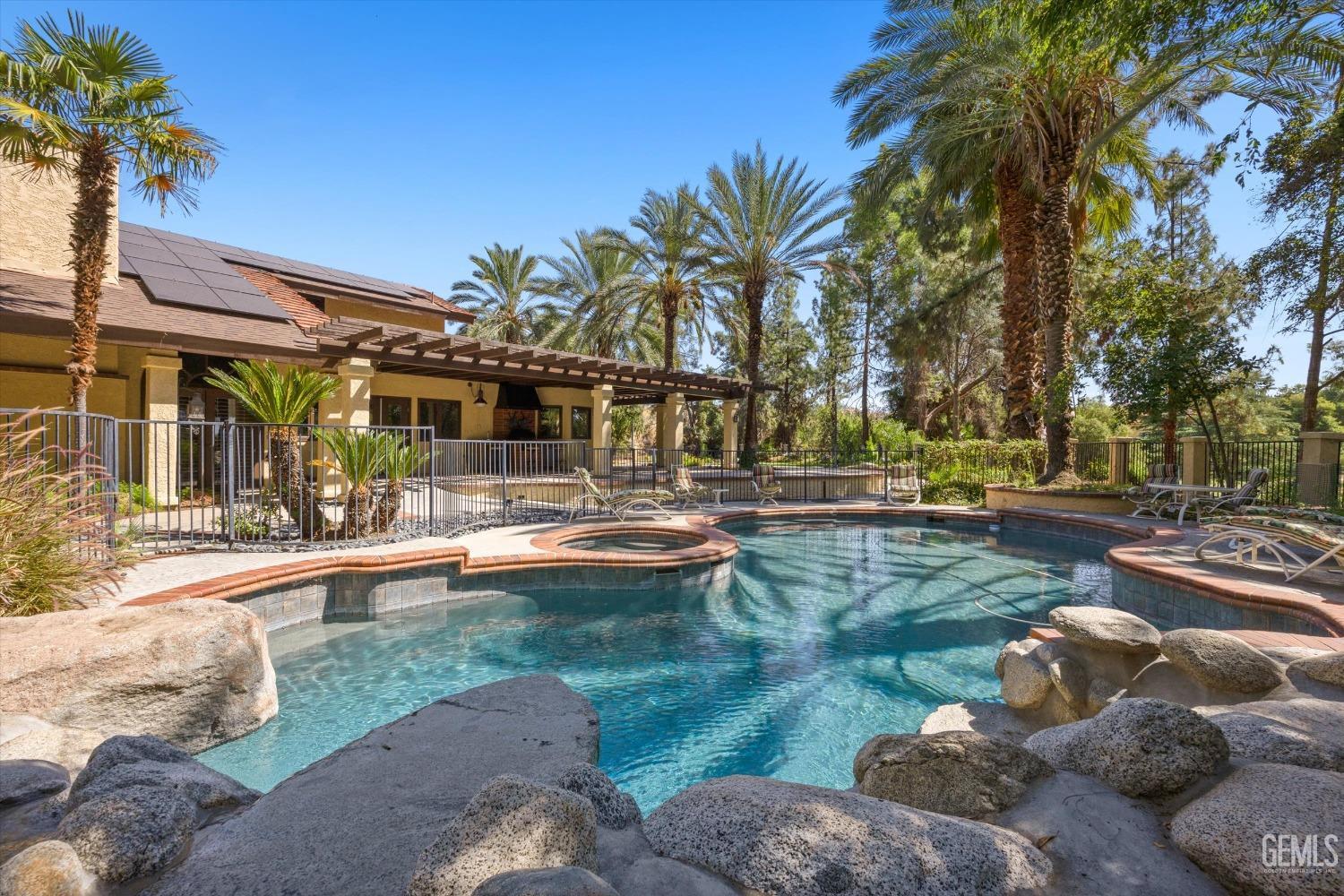Undisclosed Address Bakersfield, CA 93306 - Photo 60 of 75 a view of a swimming pool with a patio