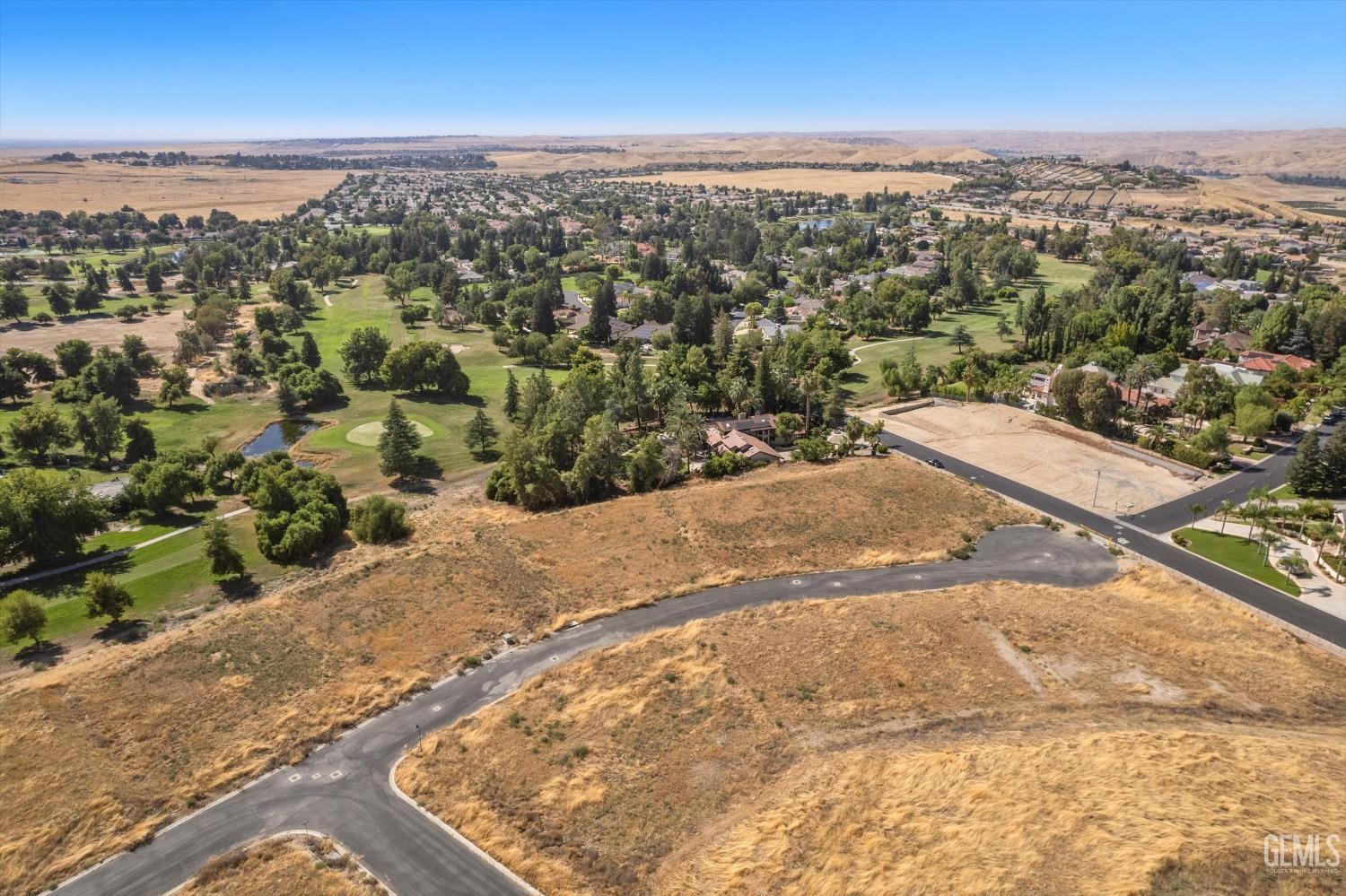 Undisclosed Address Bakersfield, CA 93306 - Photo 69 of 75 an aerial view of residential houses with outdoor space