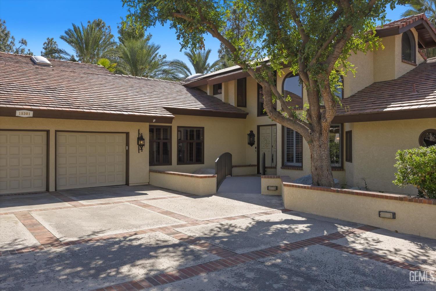 Undisclosed Address Bakersfield, CA 93306 - Photo 10 of 75 a front view of a house with a yard