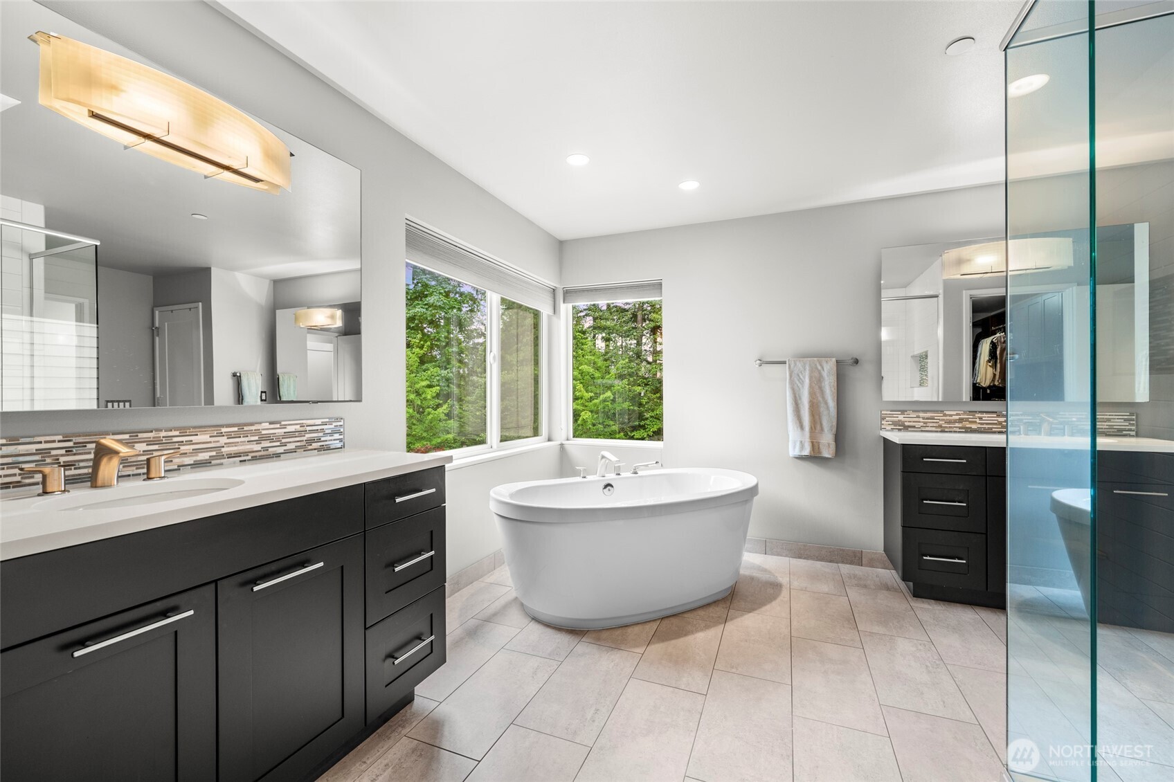 22326 2nd Place Southeast Bothell, WA 98021 - Photo 20 of 40 a bathroom with a tub sink and mirror
