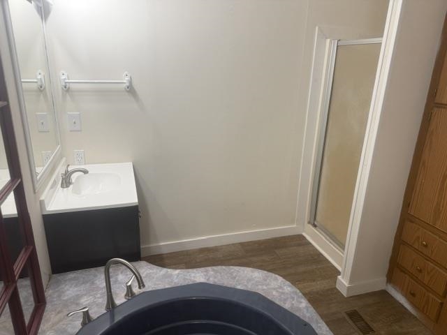 1100 Pine Top Road Toone, TN 38381 - Photo 24 of 40 Bathroom featuring a dark wood-finish vanity with an integrated white sink, a mirror, and a towel bar