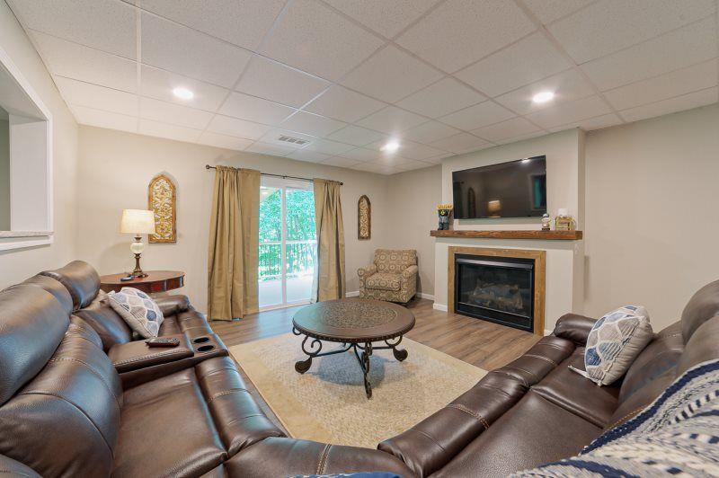 39 Schwarzwald Strasse Helen, GA 30545 - Photo 15 of 25 a living room with furniture a fireplace and a flat screen tv