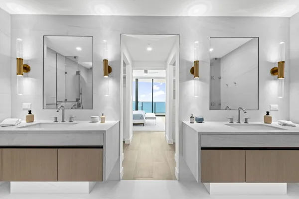 a bathroom with a double vanity sink mirror and double