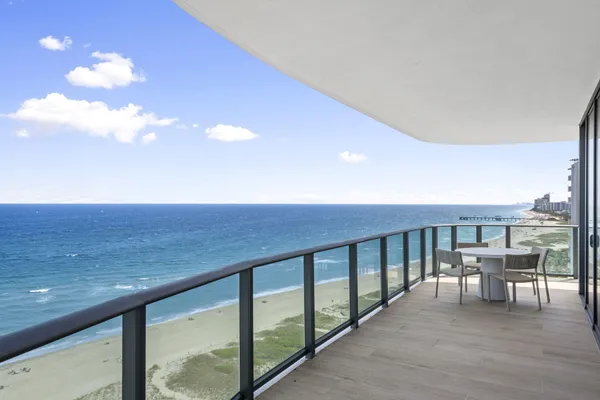a view of a balcony with chairs