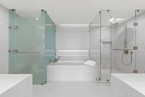 a bathroom with a tub and shower