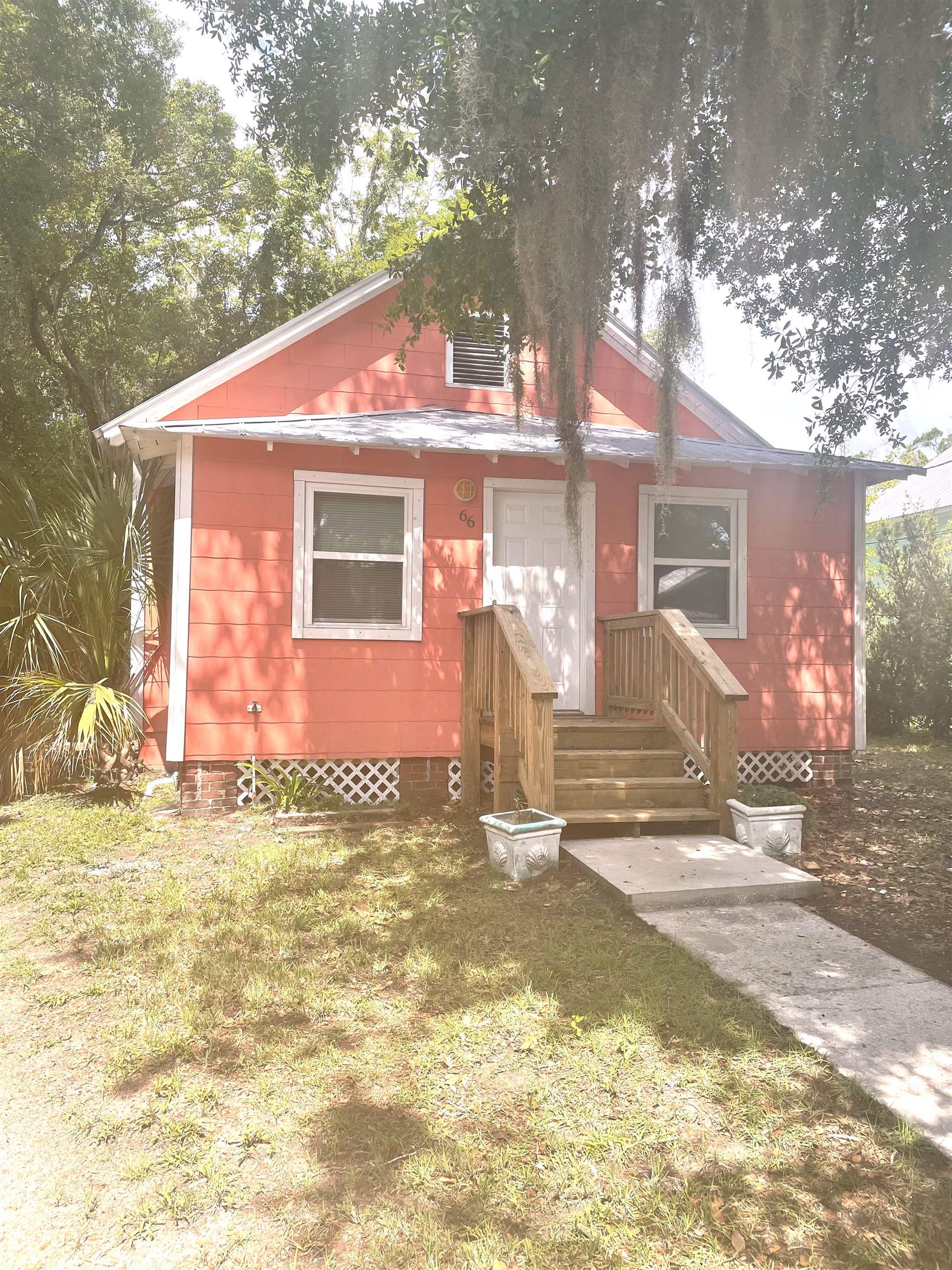 66 Palmer Street St. Augustine, FL 32084 - Photo 1 of 9 a view of a house with a yard