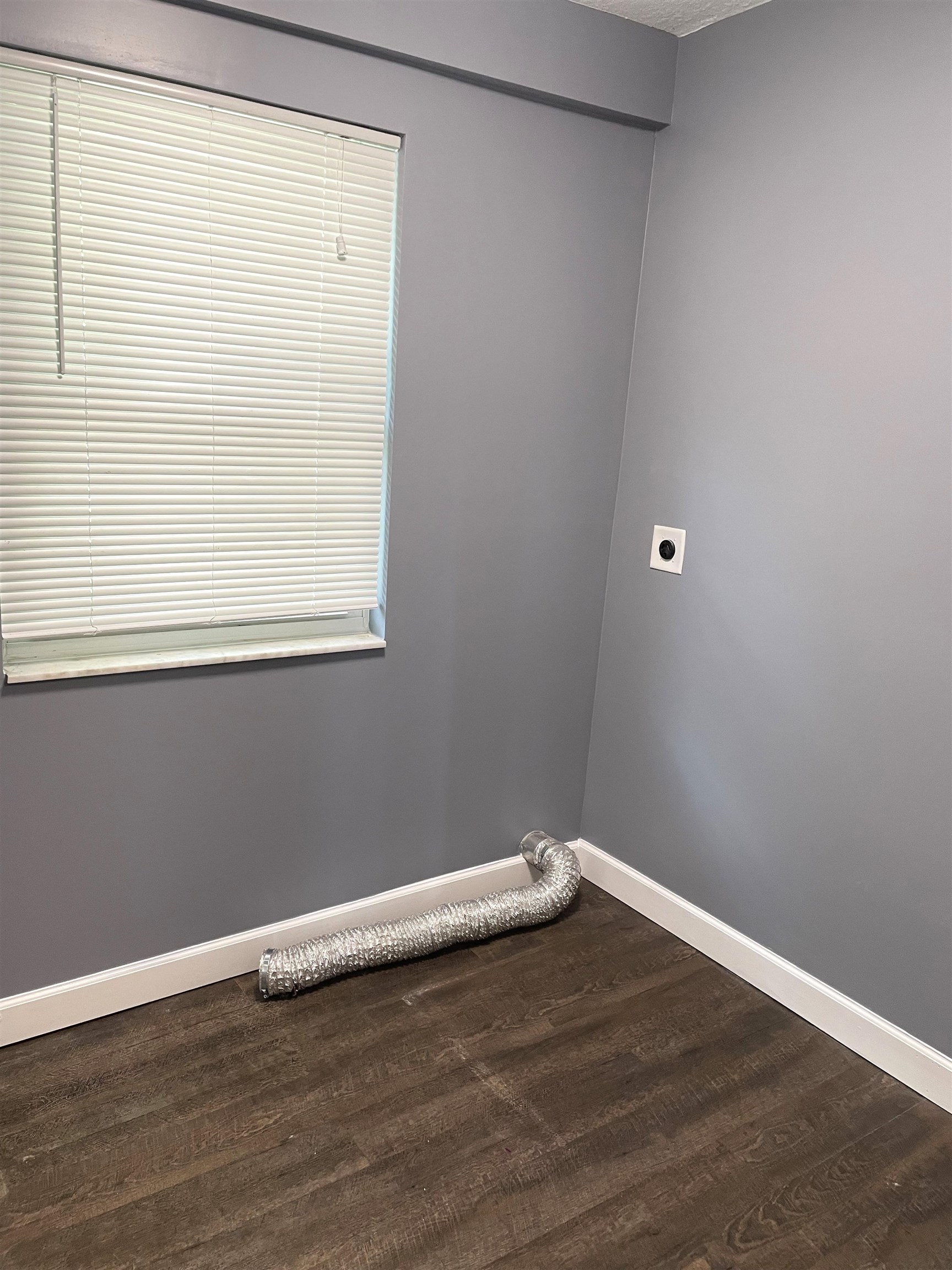 66 Palmer Street St. Augustine, FL 32084 - Photo 3 of 9 a view of a small space with wooden floor and a window