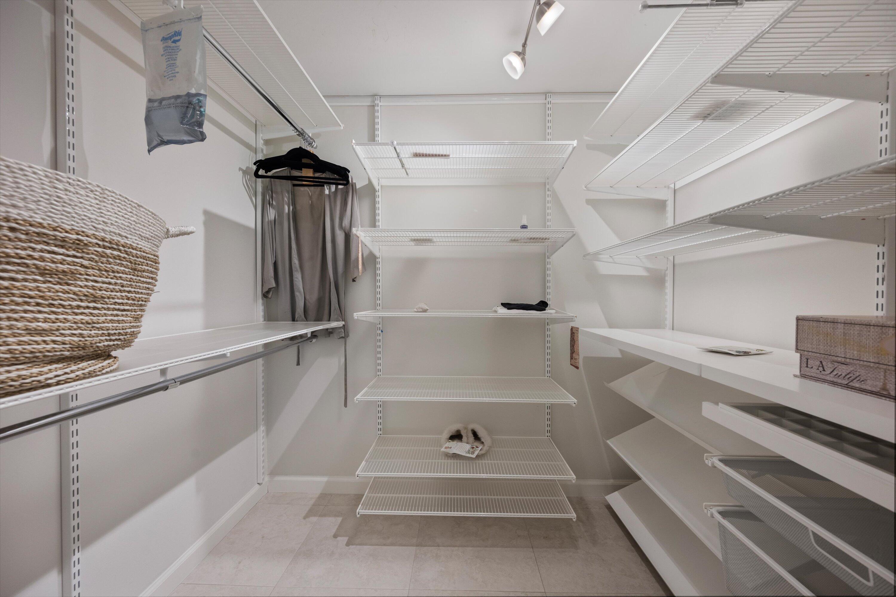 13334 Polo Club Road, Unit 228 Wellington, FL 33414 - Photo 15 of 26 a view of walk in closet with empty racks