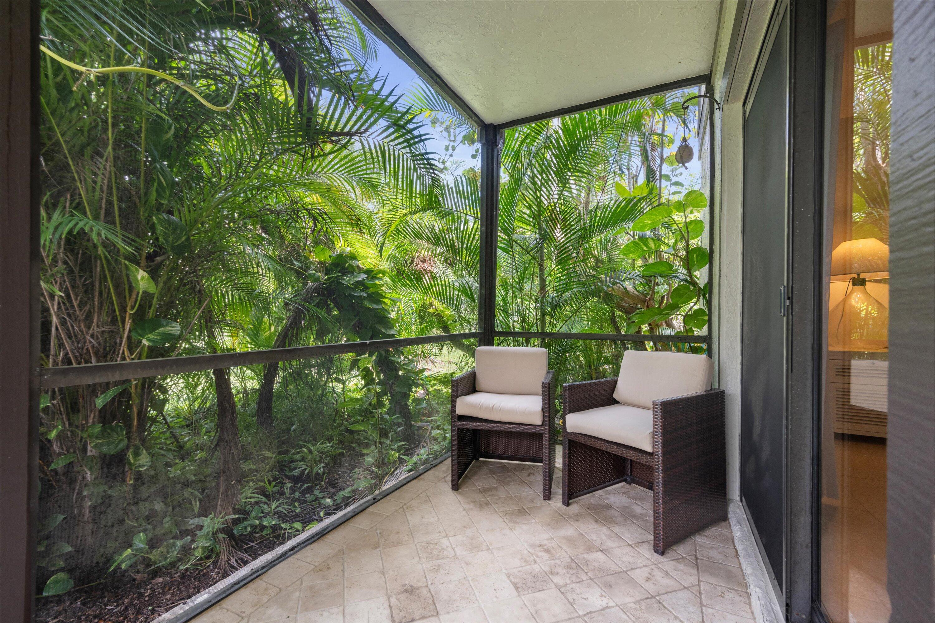 13334 Polo Club Road, Unit 228 Wellington, FL 33414 - Photo 21 of 26 a view of a two chairs in the balcony