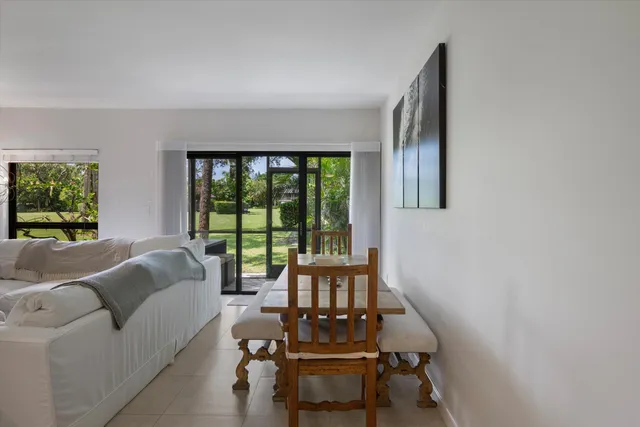 a kitchen with stainless steel appliances kitchen island granite countertop a refrigerator and cabinets