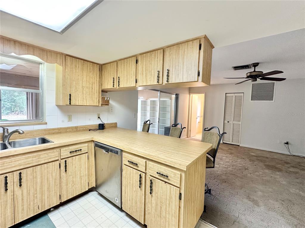7414 Acorn Circle Spring Hill, FL 34606 - Photo 20 of 50 a kitchen with cabinets appliances and a sink