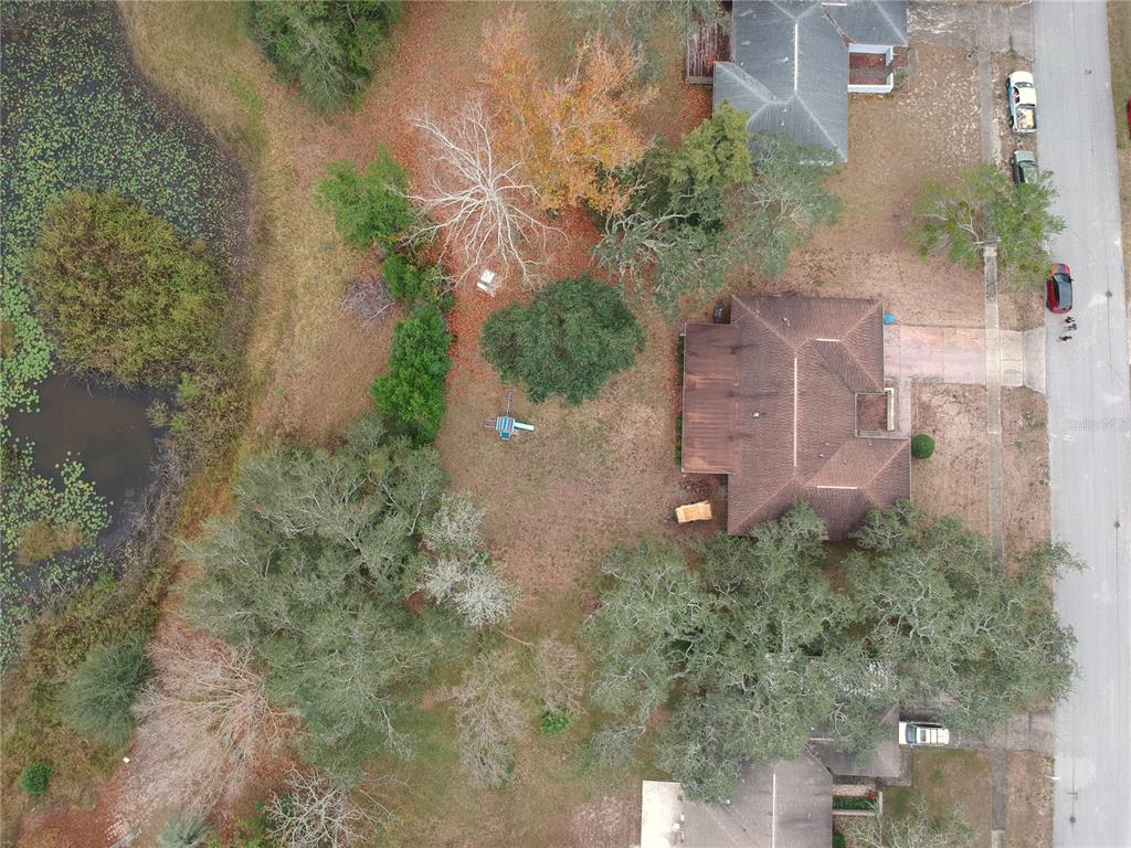 7414 Acorn Circle Spring Hill, FL 34606 - Photo 2 of 50 an aerial view of a house with a yard