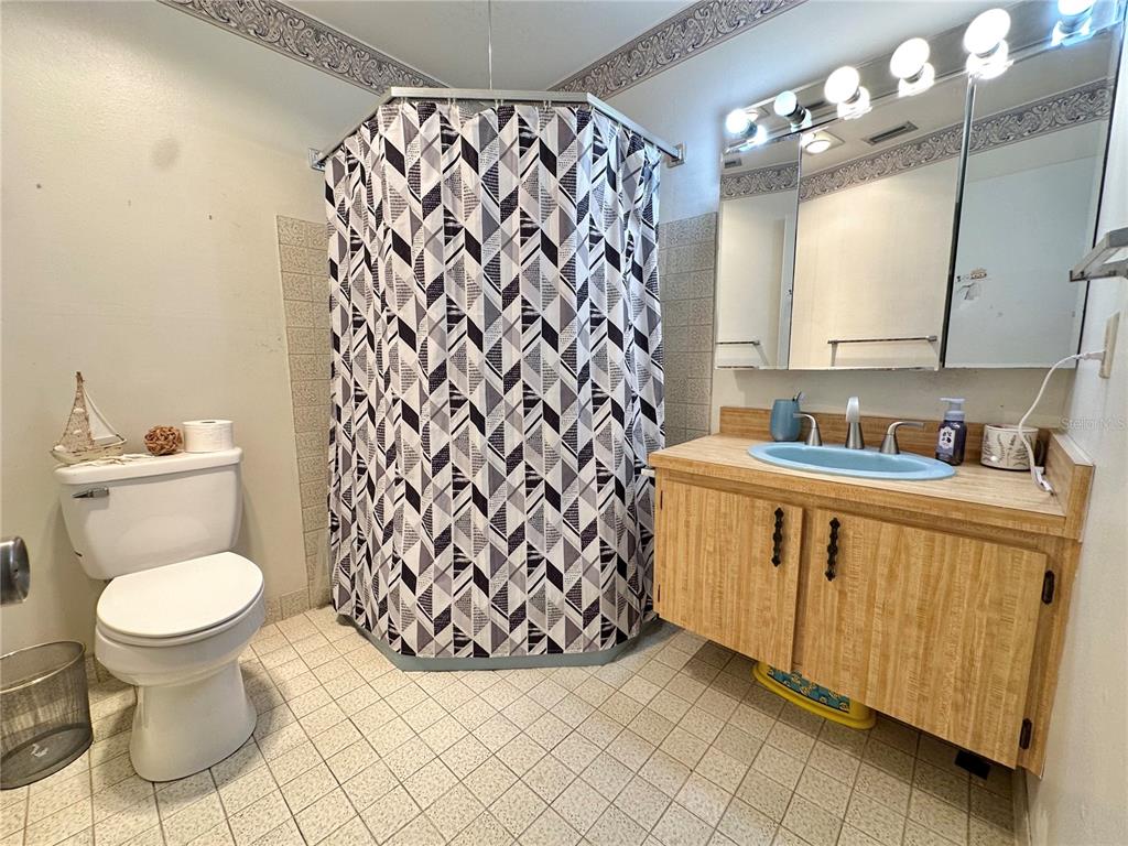 7414 Acorn Circle Spring Hill, FL 34606 - Photo 24 of 50 a bathroom with a sink toilet and a mirror