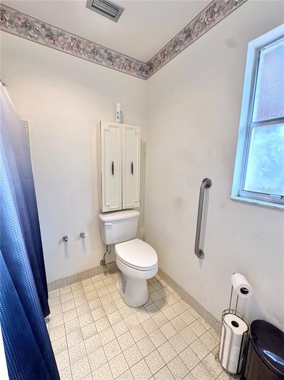 7414 Acorn Circle Spring Hill, FL 34606 - Photo 30 of 50 a bathroom with a toilet and a shower