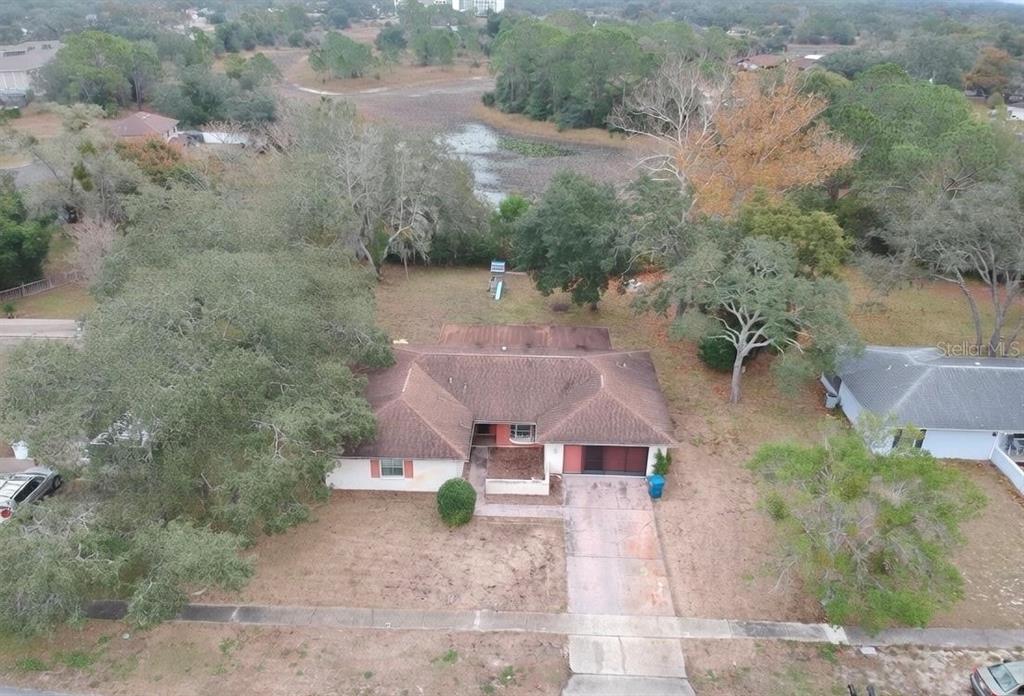 7414 Acorn Circle Spring Hill, FL 34606 - Photo 3 of 50 an aerial view of a house with a yard