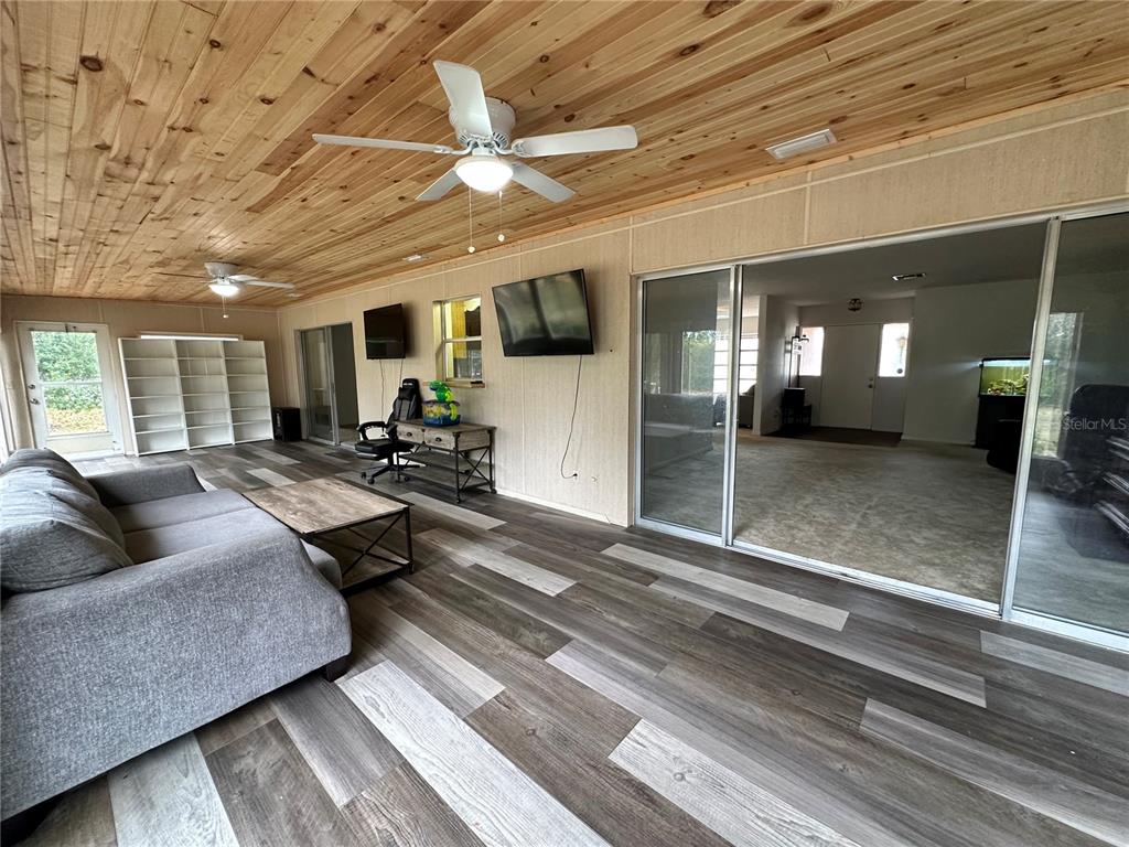 7414 Acorn Circle Spring Hill, FL 34606 - Photo 32 of 50 a living room with furniture and a rug