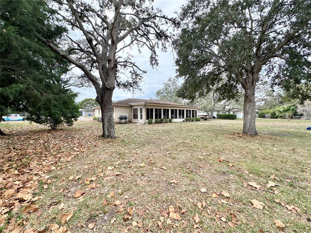 7414 Acorn Circle Spring Hill, FL 34606 - Photo 39 of 50 a front view of a house with a yard