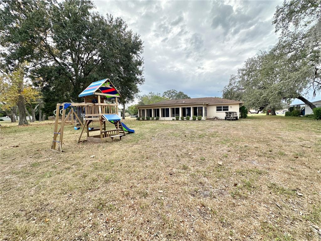 7414 Acorn Circle Spring Hill, FL 34606 - Photo 40 of 50 a view of a house with a yard