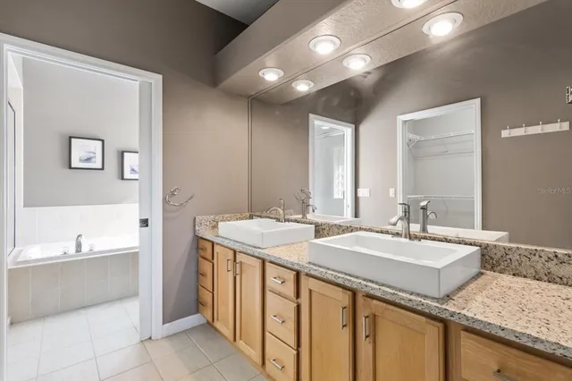 a bedroom with a bed dresser and a window