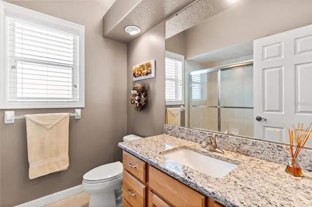 a view of a patio with couches and a fire pit