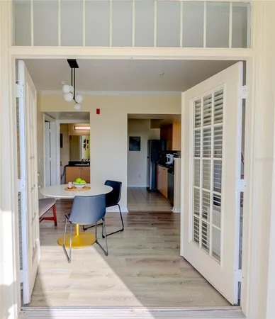 a workspace with wooden floor and a window