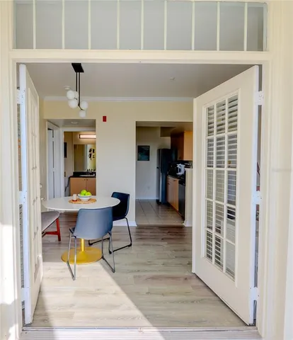 a workspace with wooden floor and a window