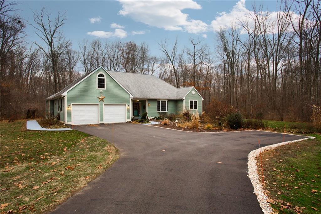 238 Kearney Road Pomfret, CT 06259 - Photo 1 of 1 a front view of a house with yard and trees