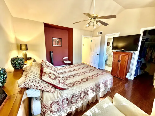 a bedroom with a bed window and a table