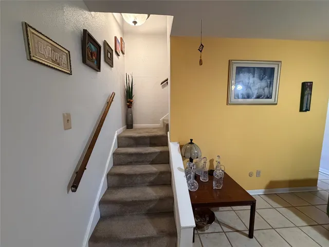 a view of a hallway with seating area