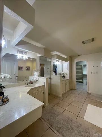 a kitchen with a sink and cabinets