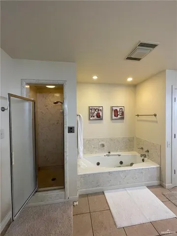 a bathroom with a shower and a toilet