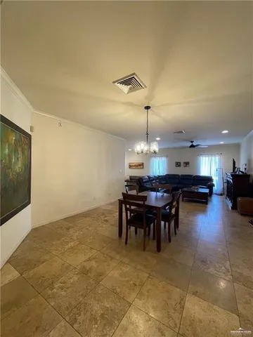 a large kitchen with a large counter top appliances and cabinets