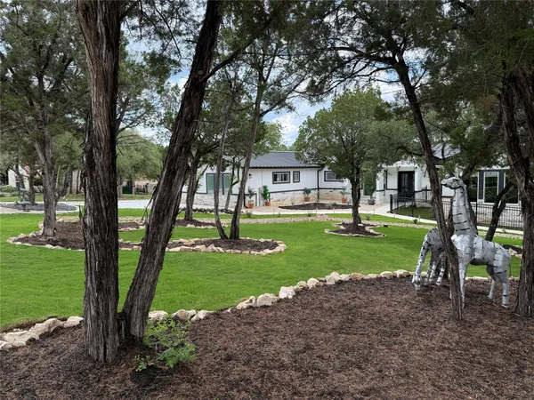 a view of a house with a backyard