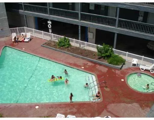 a bedroom with a bed and a television