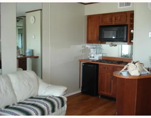 a view of a dining room with furniture and window