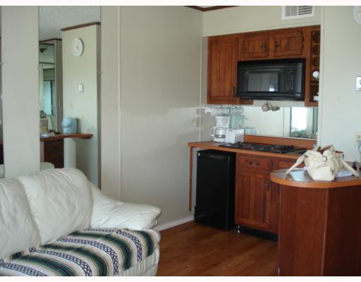 3938 Surfside, Unit 3336 Corpus Christi, TX 78402 - Photo 3 of 7 a bedroom with a bed and a television