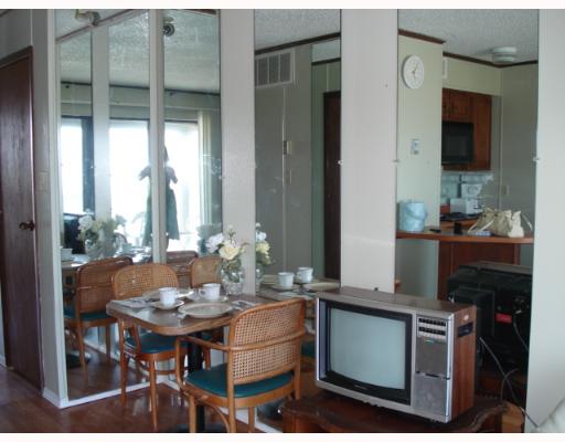 3938 Surfside, Unit 3336 Corpus Christi, TX 78402 - Photo 4 of 7 a view of a dining room with furniture and window
