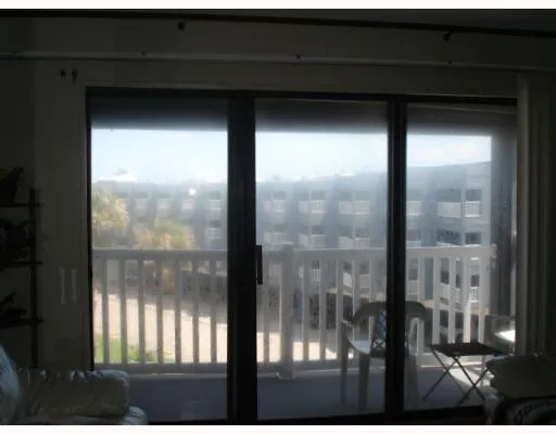 a view of a backyard with sitting area