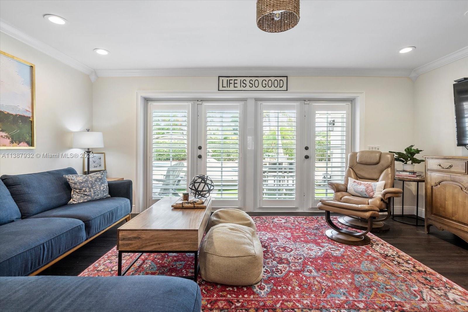 2533 Northeast 21st Terrace Lighthouse Point, FL 33064 - Photo 12 of 45 a living room with furniture and a large window