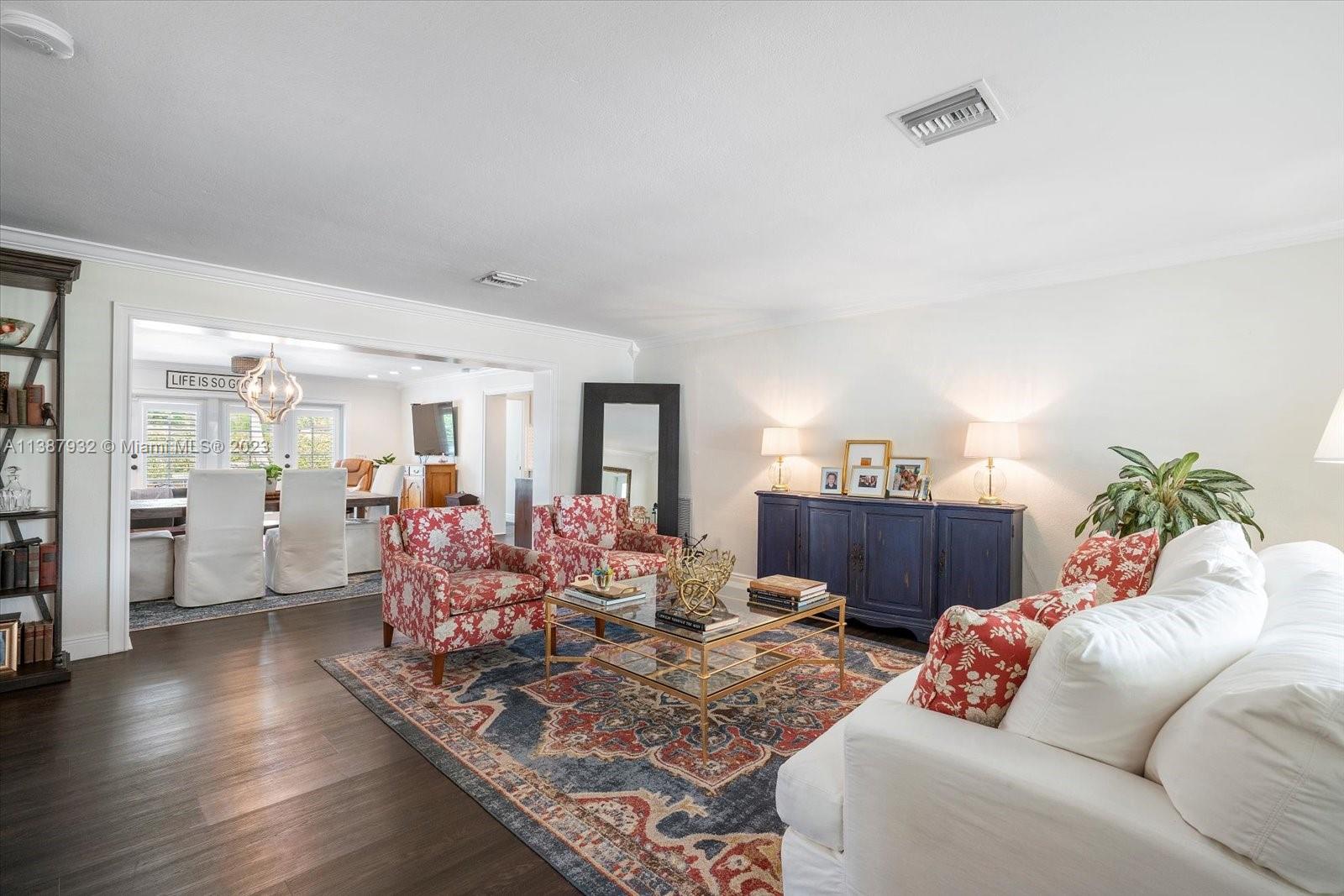2533 Northeast 21st Terrace Lighthouse Point, FL 33064 - Photo 2 of 45 a living room with furniture and a wooden floor