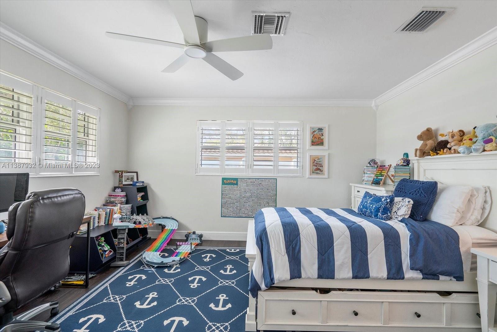 2533 Northeast 21st Terrace Lighthouse Point, FL 33064 - Photo 27 of 45 a bedroom with furniture and a window