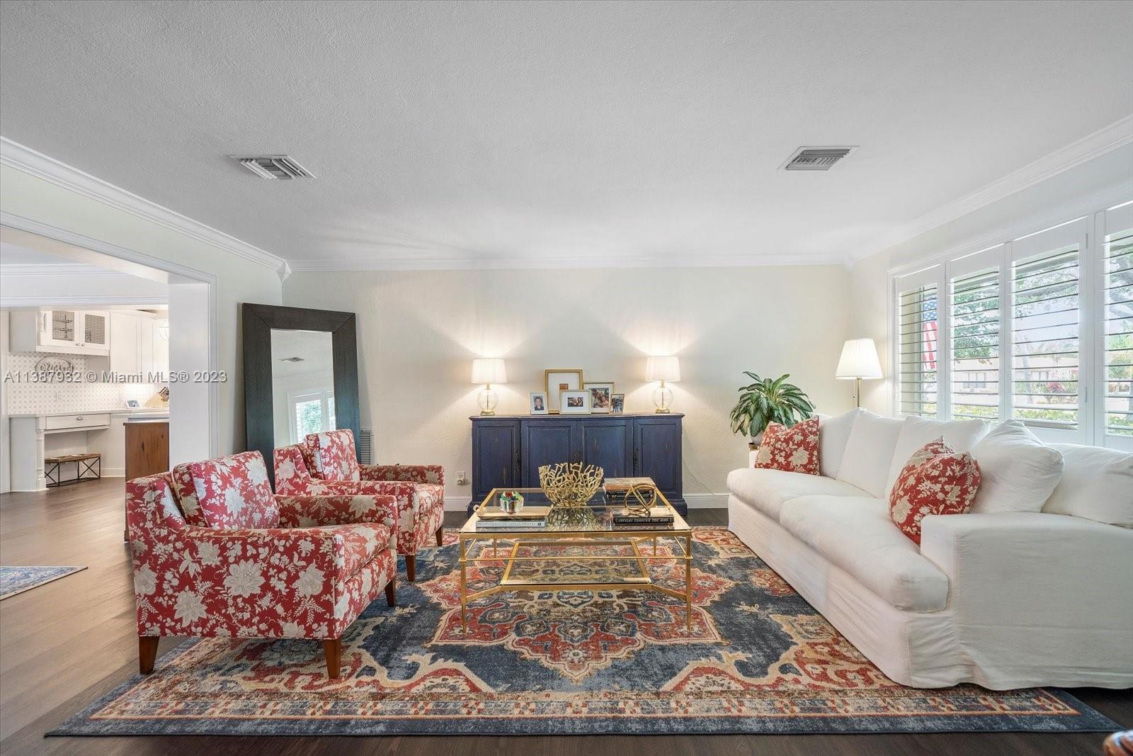 2533 Northeast 21st Terrace Lighthouse Point, FL 33064 - Photo 3 of 45 a living room with furniture and a potted plant