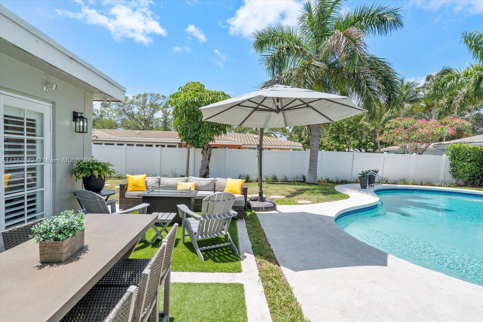 2533 Northeast 21st Terrace Lighthouse Point, FL 33064 - Photo 38 of 45 a view of a patio with furniture and a table