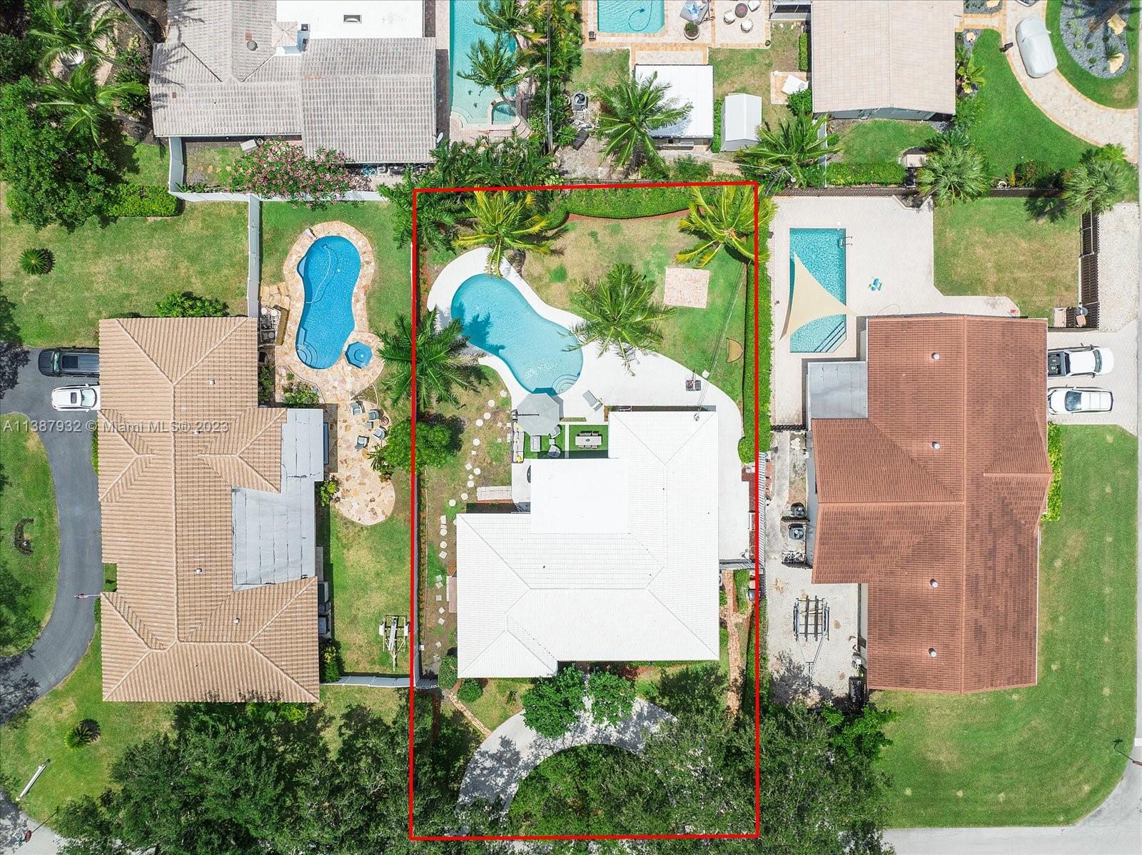 2533 Northeast 21st Terrace Lighthouse Point, FL 33064 - Photo 42 of 45 an aerial view of a house with swimming pool and outdoor seating